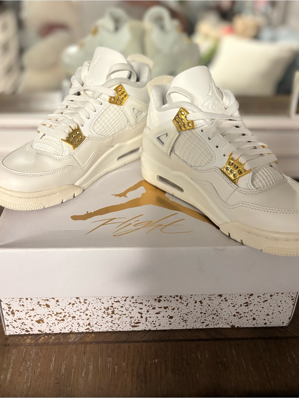 Jordan White and Gold Air Jordan 4 Sneakers